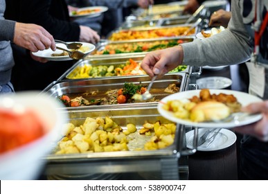 Cuisine Culinary Buffet Dinner Catering Dining Food Celebration Party Concept. Group of people in all you can eat catering buffet food indoor in luxury restaurant with meat and vegetables.