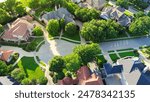 Cul-de-sac dead end street in upscale suburbs Dallas residential neighborhood expensive two-story mansion houses lush greenery trees, well-trimmed front yard landscape, Texas, aerial view. USA