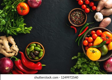 Culinary Background With Fresh Raw Vegetables Lying Down On A Kitchen Table Dark Surface, Flat Lay Composition With A Space For A Text