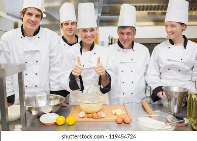 Culinary Class With Pastry Teacher Giving Thumbs Up In Kitchen