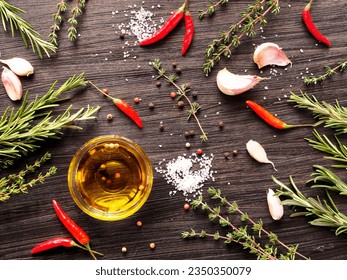 Culinary Ingredients Flat Lay - Thyme, Rosemary, Garlic, Chili, Sea Salt, Olive Oil.