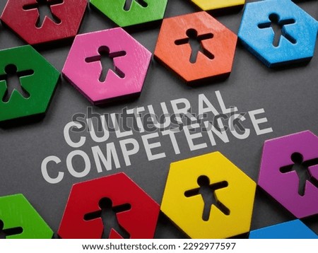 Cultural competence sign and small colorful figurines.