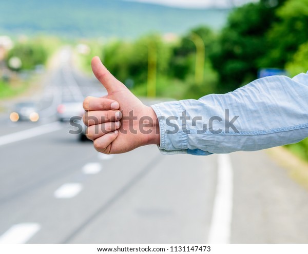 Cultural difference. Thumb up inform drivers\
hitchhiking. But in some cultures gesture offensive risk to be\
killed by furious driver you just insulted. Hitchhiking culture.\
Thumb up gesture\
meaning.