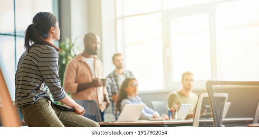 Cultural mix of young people working in a company - Shutterstock ID 1917902054