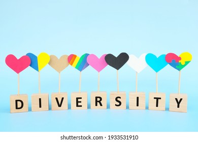 Cultural, racial, gender, age and general equality, inclusion, love and diversity concept. Multicolored heart shape icons in blue background.	