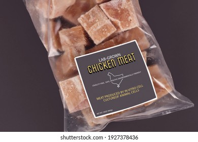 Cultured Chicken Meat Concept For Artificial In Vitro Cell Culture Meat Production With Frozen Packed Raw Meat With Label On Dark Background