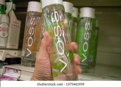 Culver City, California/United States - 4/5/19: A Hand Holds Bottle Of Voss Water At The Grocery Store