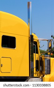 Cumberland County, PA, USA - July 2, 2018: A Bright Yellow Semi-truck Cab Is Parked At A Popular Truck Stop In Central Pennsylvania.