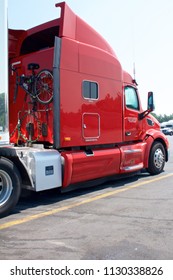 Cumberland County, PA, USA - July 2, 2018: A Bicycle Is Mounted On The Rear Of A Red Semi-truck Cab In The Parking Lot Of A Popular Truck Stop In Central Pennsylvania.