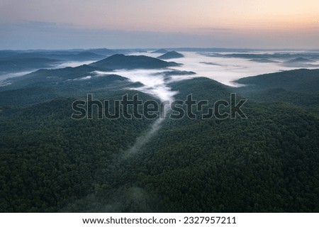 Cumberland Gap through Cumberland Mountains, within Appalachian Mountains. Tripoint of Kentucky, Virginia, and Tennessee. Pinnacle Overlook at key passageway. Foggy sunrice
