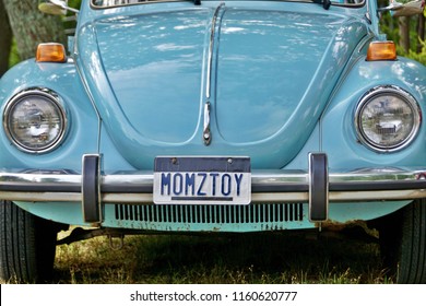 Cumberland, RI/USA- August 19, 2018: A Horizontal Image Of The Front Vanity Plate Of A Powder Blue VW Beetle On Display At An Annual Summer Car Show. 