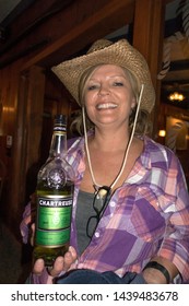 CUMBERLAND, WISCONSIN - OCTOBER 29, 2016: Restaurant Server Holding A Bottle Of Green Chartreuse My Favorite Liqueur. 