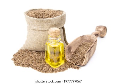 Cumin essential oil. Glass bottle of cummin oil. Caraway in a sack of isolated on a white background. Caraway in a burlap sack. Healthy food.Vegan food. Copy space.Vegan food. Superfood and vitamins.  - Powered by Shutterstock