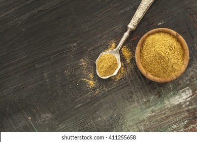 Cumin Powder On Wooden Background