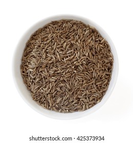 Cumin Seeds In Bowl, Isolated On White.  Overhead View.