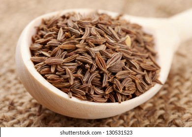 cumin seeds in wooden spoon - Powered by Shutterstock