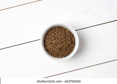 Cumin In White Bowl. Close Up