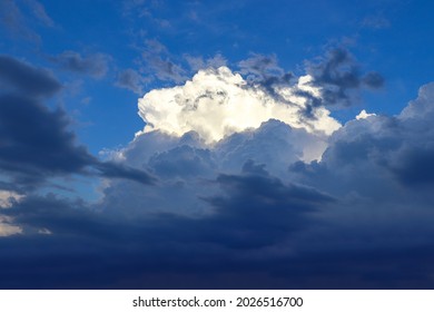 Cumulonimbus clouds in the evening at sunset. Distant thunderstorm