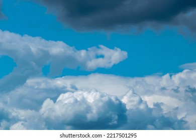 Cumulonimbus  clouds on a summer blue sky. Time before a thunder - Shutterstock ID 2217501295
