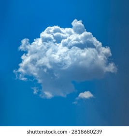 Cumulus cloud isolated against a blue sky. Neat shape of flying vapor. Dynamic, variable particle system. Remote computer calculations.