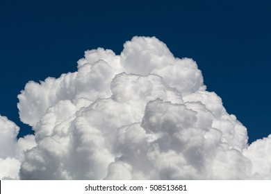 Cumulus Clouds And Blue Sky.