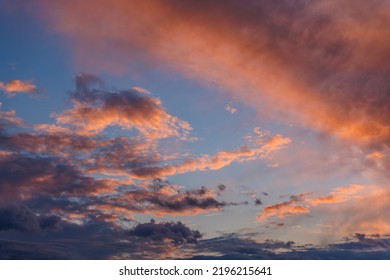 Cumulus Clouds On Evening Sky Backlit With Sunset. Captured With 70mm Lens On 35mm Full-frame Sensor Camera.