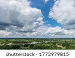 Cumulus Clouds over Vistula River in Tarnobrzeg on sunny day. Top view towards the longest river in Poland