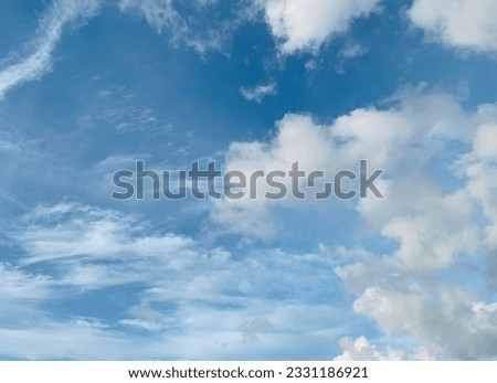 Cumulus clouds soaring high in the sky with a bright blue sky background Beautiful at Bangkok, Thailand.no focus