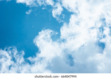 Cumulus Humilis Clouds In The Blue Sky, View From Below