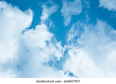 Cumulus Humilis Clouds In The Blue Sky, View From Below