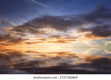 Cumulus sunset clouds with sun setting down,Clouds reflextion on during sunset