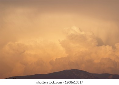 Cumulus Type Red colored clouds over the mountains.