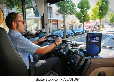 Cuneo, Italy - July 24, 2017: A driver driving an extra-urban bus line