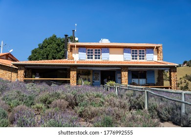 CUNHA, SAO PAULO / BRAZIL - AUG 16, 2019: The Lavender Fields Plantation Under Sunny Blue Sky In Front Of The Provencal Style Gift Shop House Porch Inside O Lavandario Farm.