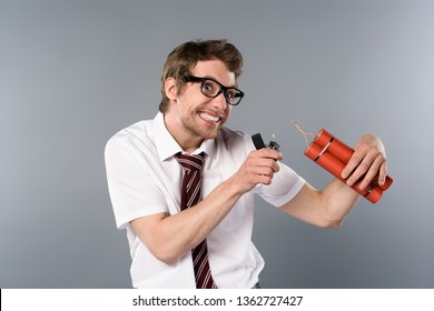 Cunning Businessman Holding Lighter And Dynamite On Grey Background