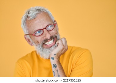 Cunning Excited Older Senior Funny Man Looking Away At Copy Space. Sneaky Old Mature Bearded Hipster Wearing Glasses Waiting With Anticipation Expectation Isolated On Yellow Background.