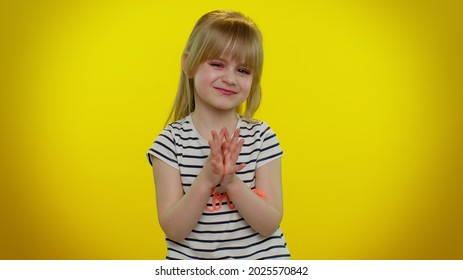 Cunning Sneaky Playful Child Girl With Tricky Face Gesticulating And Scheming Evil Plan, Thinking Over Devious Villain Idea, Cunning Cheats, Jokes And Pranks. Yellow Wall Background. Teen Kid Children