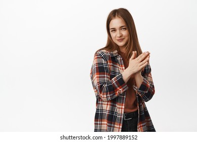 Cunning young woman has plan, rub hands and smirk devious, planning something, scheming an idea, standing against white background