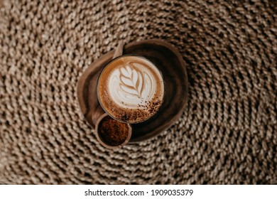Cup of aromatic coffee. Rustic background