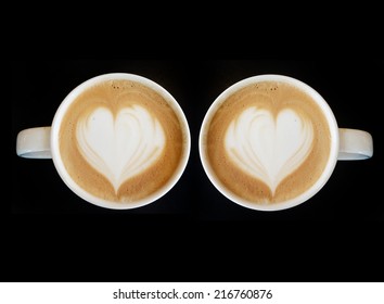 Cup of art cappuccino coffee heart symbol on top view