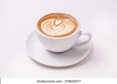 Cup of art latte on a cappuccino coffee isolated on white background