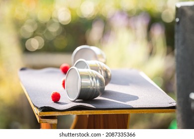 Cup And Balls Classic Sleight Of Hand Magic Trick Red Balls Silver Cups Outside In Daylight At Sunset Illusion 