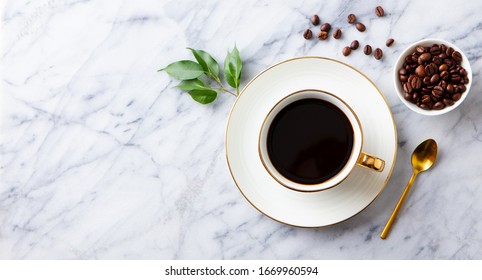 Cup Of Black Coffee With Coffee Beans On Marble Table. Copy Space. Top View.