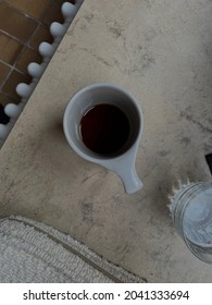 A Cup Of Black Coffee On The Marble Window Sill