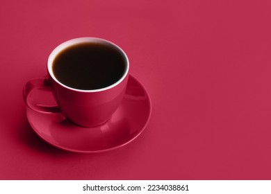 Cup of black coffee on viva magenta background. Space for text. Trending color of 2023 - Viva Magenta. - Shutterstock ID 2234038861