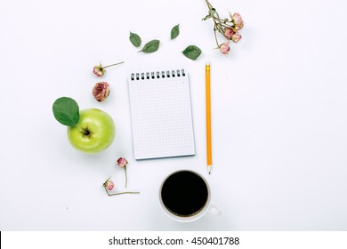 Cup of black coffee, sketchbook with pencil and dry rose flowers. Flat lay, top view - Powered by Shutterstock