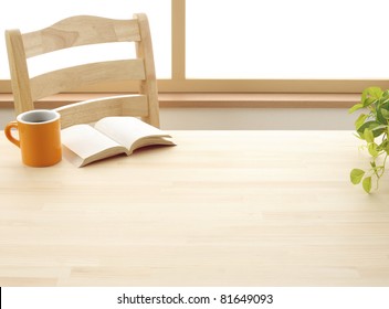 Cup Book And Plant On Wooden Table