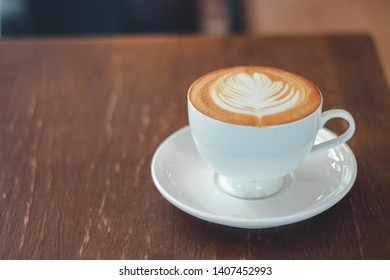 cup of cappuccino art on wooden background. - Shutterstock ID 1407452993