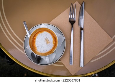 Cup Of Cappuccino At Breakfast On An Outdoor Table At A Bakery Cafe In Old Town Or Vieille Ville In Nice, South Of France, Top Down View