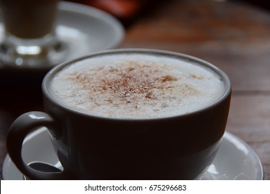Cup of cappuccino coffee close up